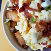 Breakfast Nachos  · Crispy golden tater tots, covered with our cheese sauce, crispy bacon, house salsa, and sour...