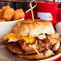 Wonderful Day Sandies · Sausage patty, candied bacon, smoked gouda, fried egg and house blackberry jam on a buttermi...