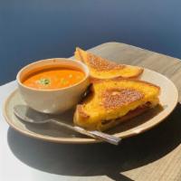 Grilled Cheese Sandies · Cheddar, Jack, and Gouda cheeses with sliced tomatoes on grilled sourdough bread. Served wit...