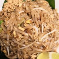 23. Pad Thai · Stir-fried Thai noodles with chicken or shrimp, egg, bean sprouts and dry tofu topped with g...