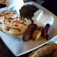 El Salvadoreno · The salvadoran. Platano frito, frijoles, dos huevos, tortillas echas a mano, crema, and ques...