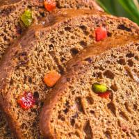 Spice Bun · This soft, dark, sweet bread boasts a mix of fruits and raisins. Pairs perfectly with your f...