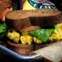 Curry Chicken Salad Sandwich - served cold · Sweet wheat bread, house made curry chicken salad, dressed house greens and fresh sliced tom...