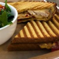 Southwest Chicken Panini - served hot · Rustic white bread, blackened chicken, roasted red peppers, sauteed fajita onions, jalapeno ...
