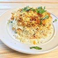Chicken Biryani Platter · Long grined rice flavored with a blend of specialty herbs and spices are marinated with bone...