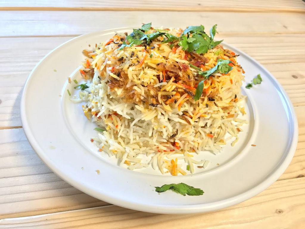 Chicken Biryani Platter · Long grined rice flavored with a blend of specialty herbs and spices are marinated with boneless chicken breast. Includes meat, mixed salad toping. Served with our signature green sauce.