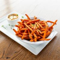 Sweet Potato Shoestring Fries · Smothered in sea salt, served with chipotle aioli.