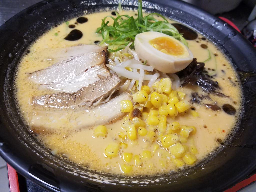 N6. Miso Ramen · Pork based broth with miso, chashu, soft-boiled egg, green onion, black mushroom, bean sprouts, buttered corn and garlic oil.