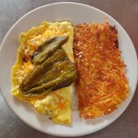 Ortega Ham and Cheese Omelette · Ortega chili with diced ham and cheese omelet add your choice of hash browns or country pota...