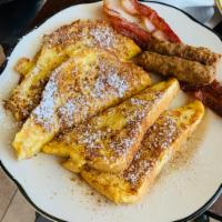 French Toast Combination · 4 halves with 2 bacon, 2 sausage links and 2 eggs.