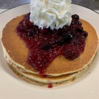 Pancakes with fruit (2) · Choice of strawberries, blueberries or peaches topped w/ whip cream.