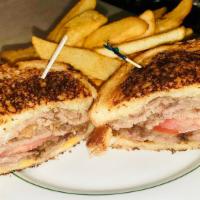 Roast Beef Deluxe Sandwich · Bacon, tomato topped with Swiss and American cheese, grilled on sourdough.
