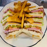 Club Sandwich · Sliced bacon, ham, turkey with American and Swiss cheese. Includes mayo on white bread.