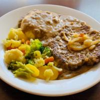 Ground Beef Staek w/mushrooms gravy · Seasoned ground beef simmered in a savory mushroom sauce, and your choice of mash potatotes ...