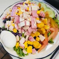 Chef Salad · Turkey and ham sliced over a green salad, hard-boiled eggs, tomato, cucumber with a blend of...