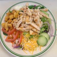 Grilled Chicken Breast Salad · Grilled chicken breast chopped over a fresh green salad, tomato, cucumber and your choice of...