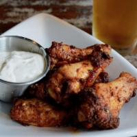 Smoked Wings · 6 or 10 wings tossed in house rub served with choice of ranch or blue cheese dressing.