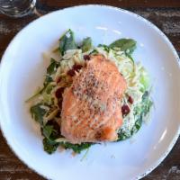 Salmon & Brussels · Smoked salmon filet served over a bed of kale and Brussels sprouts with dried cranberries, b...