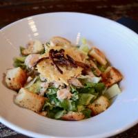 Caesar Salad · Romaine hearts, garlic croutons, Parmesan crisps and crispy shallots served with Caesar dres...