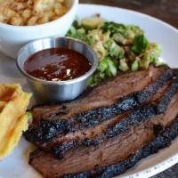 Sliced Brisket Plate · Texas inspired prime black Angus smoked brisket choice of lean, fatty or mixed.