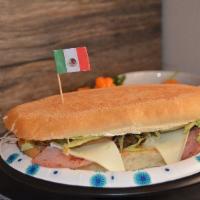 Torta Michoacana · Roasted Seasoned Pork (Al Pastor), Hot Dog, and White Cheese. 
