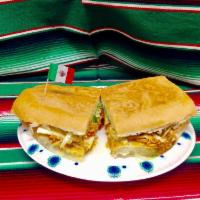 Torta Mexicana · Seasoned Chicken (Tinga de Pollo), Ham, and White Cheese.
