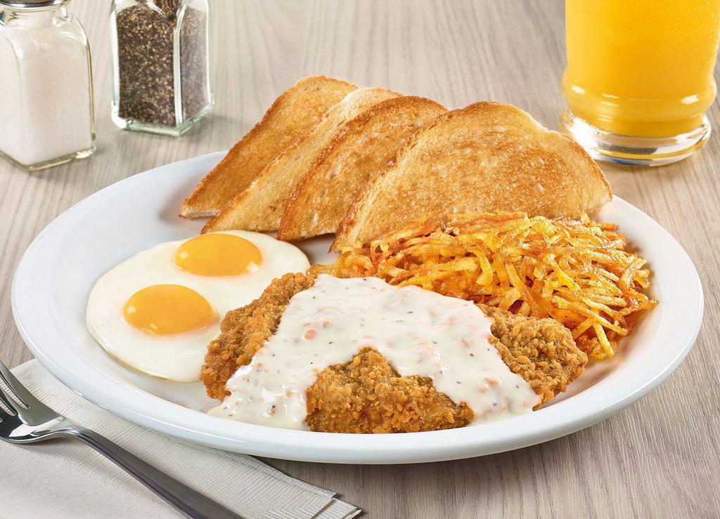Country-Fried Steak & Eggs · A chopped beef steak smothered in country gravy. Served with two eggs, hash browns and bread.
