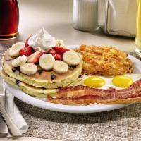 Double Berry Banana Pancake Breakfast  · Buttermilk pancakes cooked with blueberries and topped with fresh seasonal berries, bananas ...