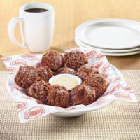 NEW! Double Chocolate Pancake Puppies®  · Made with Ghirardelli(R) cocoa and chocolate chips, tossed in powered sugar and served with ...