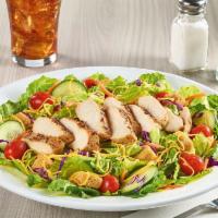 House Salad · Cucumbers, grape tomatoes, Cheddar cheese and croutons atop a bed of iceberg mix. Served wit...