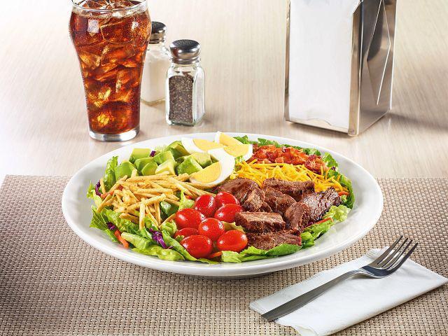 Cobb Salad  · Bacon, fresh avocado, grape tomatoes, Cheddar cheese, hard-boiled egg and potato sticks atop a bed of iceberg mix. Served with your choice of dressing. Gluten-free.