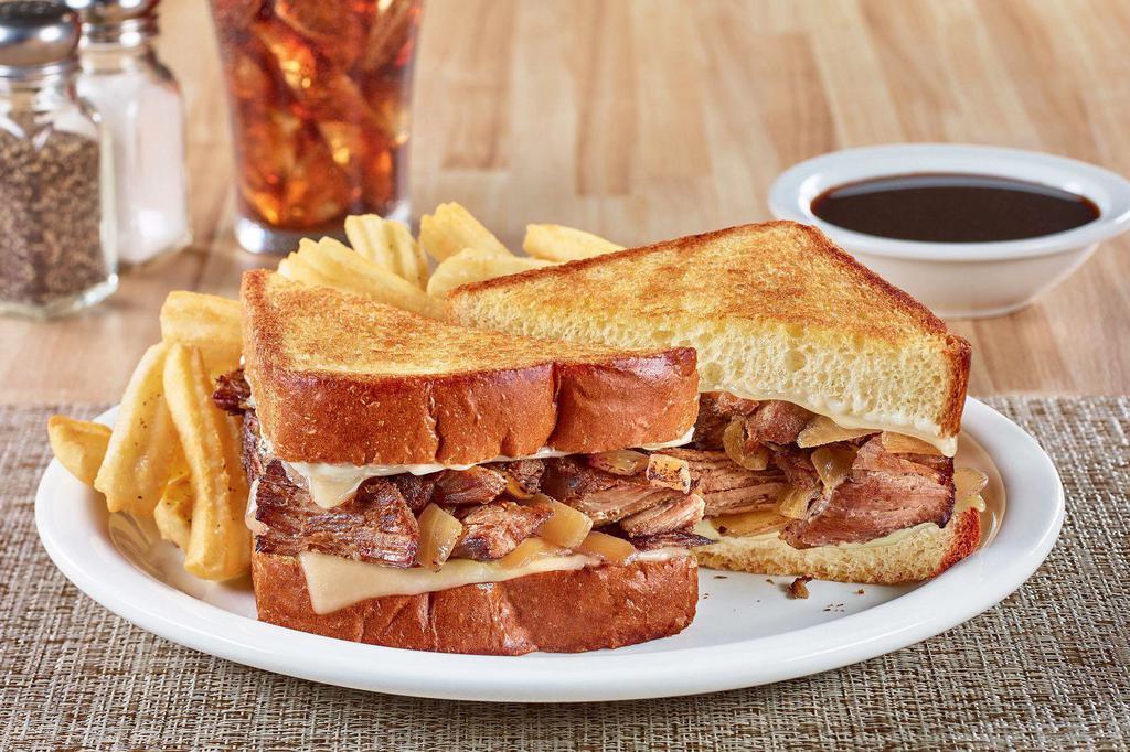 The Big Dipper · Tender pot roast with melted Swiss cheese, caramelized onions and mayo on grilled Texas toast. Served with French onion au jus for dipping and wavy-cut fries.