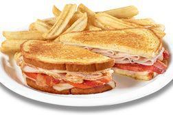 The Super Bird® · Turkey breast with Swiss cheese, bacon and tomato on grilled sourdough.