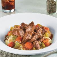 Mama D's Pot Roast Bowl · Slow-cooked pot roast atop red-skinned mashed potatoes with roasted carrots, celery and onio...