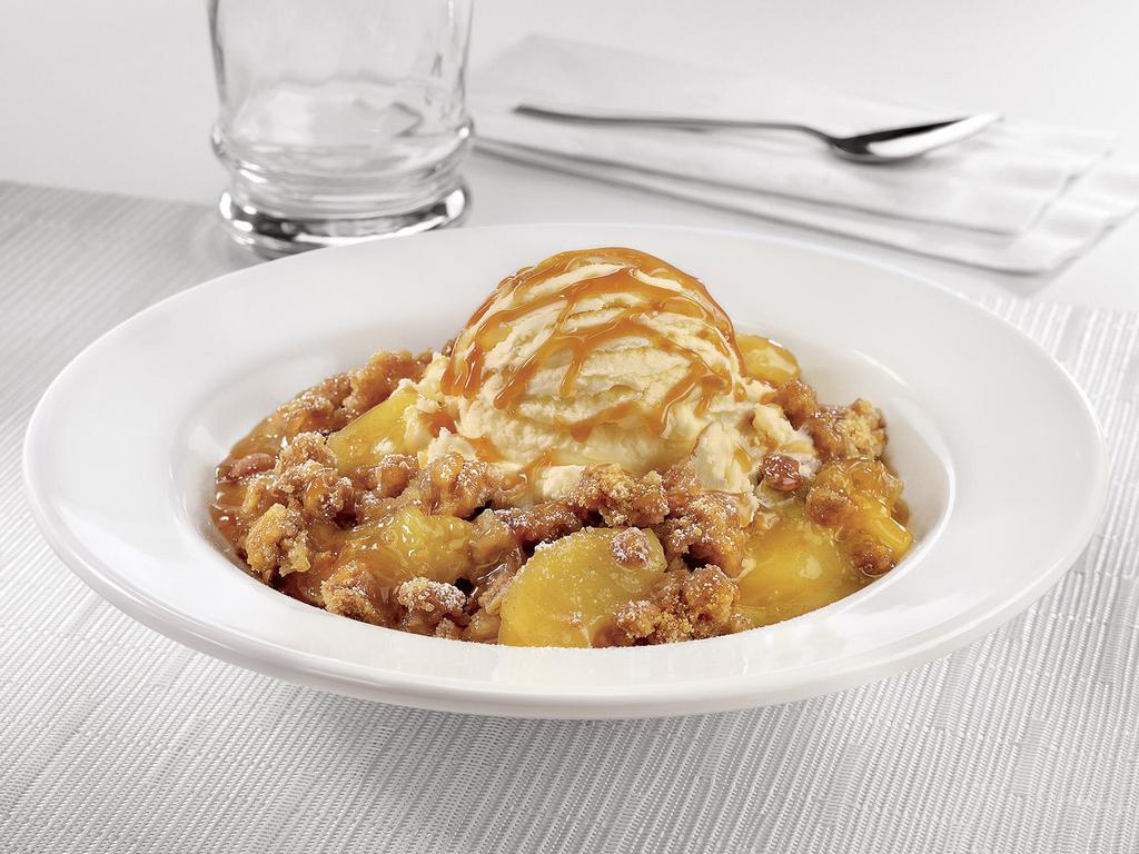 Caramel Apple Pie Crisp  · Warm apple pie crisp topped with premium vanilla ice cream, salted caramel and powdered sugar.