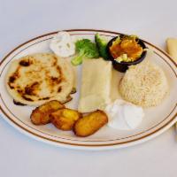 Combinacion Tipica Vegetariana · Veggie combo of a corn tamale, a cheese pupusa, plantain and veggies of the day.
