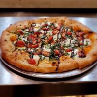 Margherita Pizza · grape tomato, fresh mozzarella, sweet basil