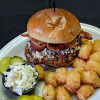 Blackened Blue Burger · Our famous half pound burger blackened then topped with bleu cheese and bacon. Our number on...