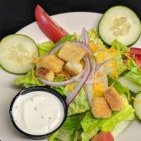 The Side Salad · The small dinner salad comes with your choice of dressing.