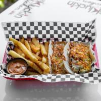 Kluckin Taco · 1 Kluckin Taco . Served on Flour Tortilla with coleslaw , Mexican Cheese, Chicken Tender Cho...