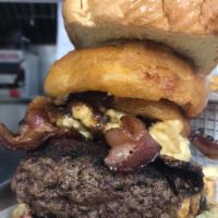 1 lb. The Kitchen Burger · Angus burger stuffed with cheddar cheese, fried pickles, hickory smoked bacon, onion rings, ...