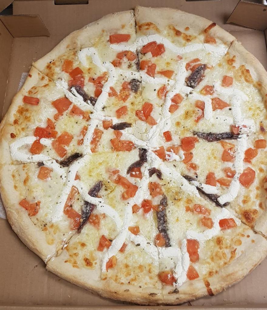 Bianca Napoletana Pizza · Fresh tomatoes and anchovies. Include olive oil, fresh garlic, mozzarella, parmesan and ricotta cheeses.