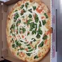 Bianca Florentine Pizza · Spinach and fresh tomatoes. Include olive oil, fresh garlic, mozzarella, parmesan and ricott...