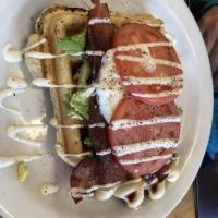 B A R T · Bacon, avocado, ranch, tomato, and an egg on top of a waffle