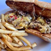 Philly Cheesesteak · Thinly Sliced Steak, Caramelized Onions,American Cheese, House Queso, Hoagie Roll 