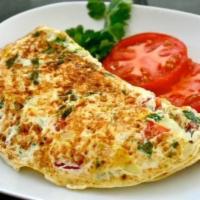 Omelette · Organic eggs. Egg whites only or whole organic eggs with your choice of 2 toppings. Served w...