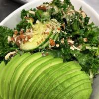 Beauty Greens Salad · Massaged kale, zucchini, cauliflower, rice, cucumber, avocado, and sliced almonds with miso ...