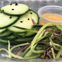 Sweet and Spicy Cucumber Salad · English cucumber and black sesame seeds.