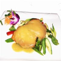 Broiled Chilean Sea Bass · Sauteed seasonal vegetables and orange miso sauce. Served with white rice or brown rice.
