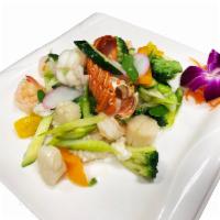 Seafood Deluxe · Lobster meat, jumbo shrimp, scallops, squid and fish cake sauteed with assorted vegetables i...